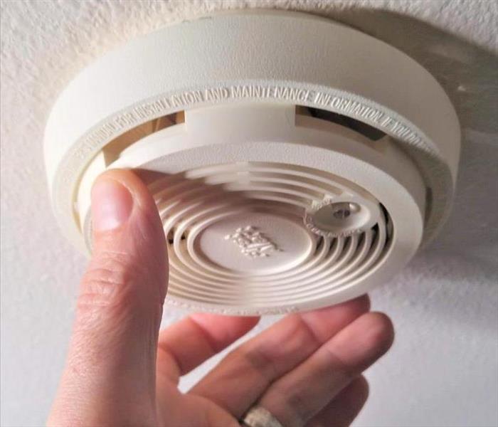 Smoke detector being changed from wall